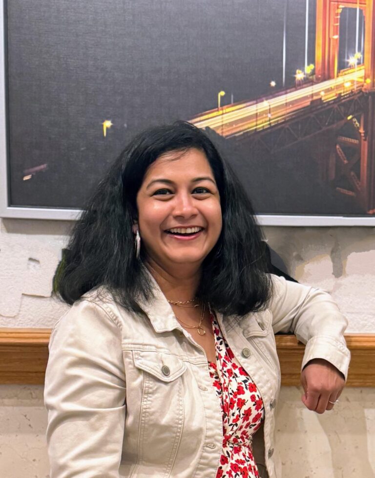 Kavita tipnis-rasal laugghing at the camera